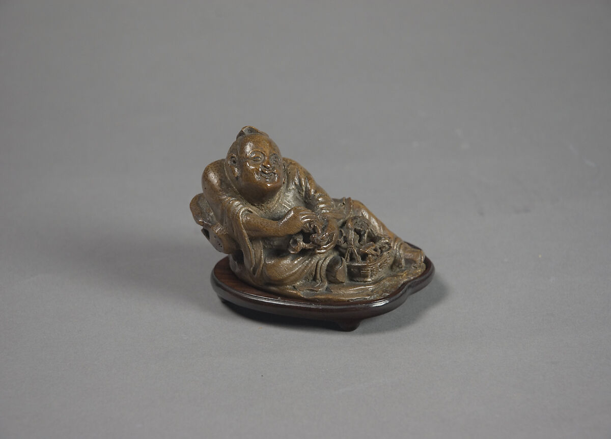 Child with basket of magical fungus, Bamboo, China