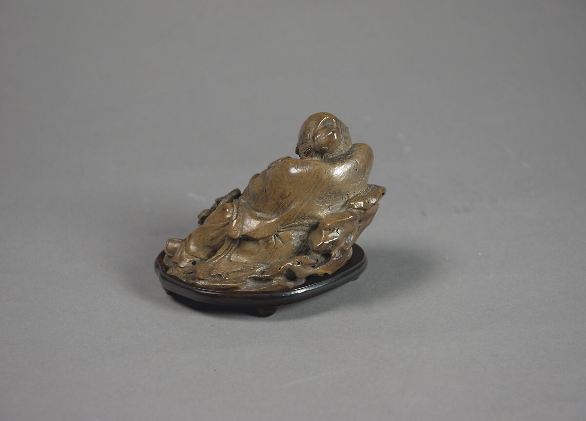 Child with basket of magical fungus, Bamboo, China