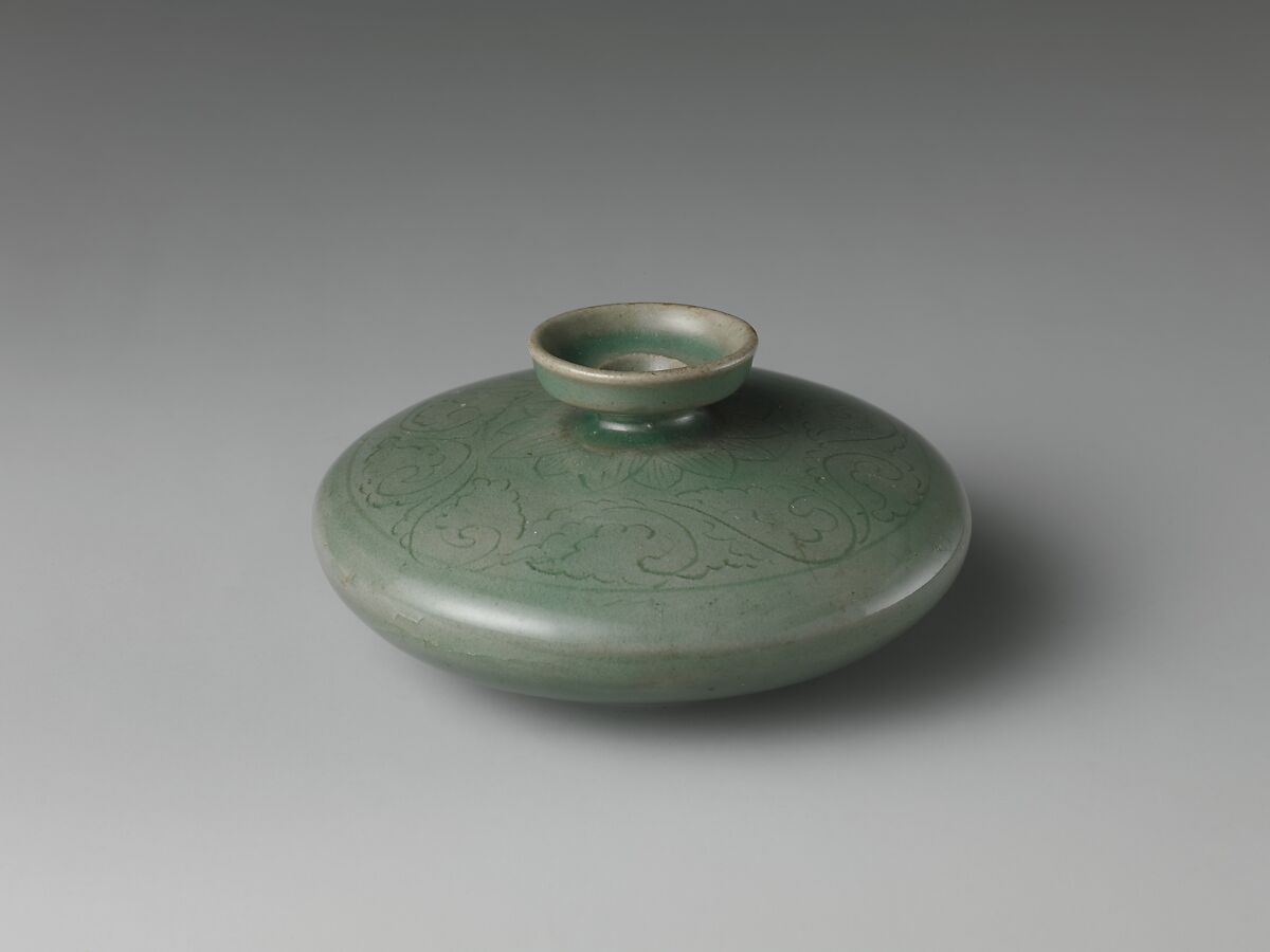 Oil bottle decorated with floral scrolls and lotus petals, Stoneware with incised design under celadon glaze, Korea 