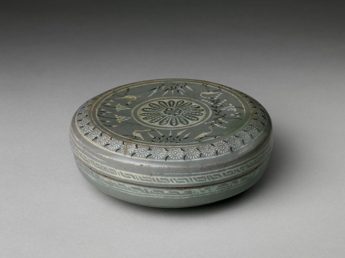 Covered box decorated with chrysanthemums and waterfowl among lotus, Stoneware with inlaid design under celadon glaze, Korea 