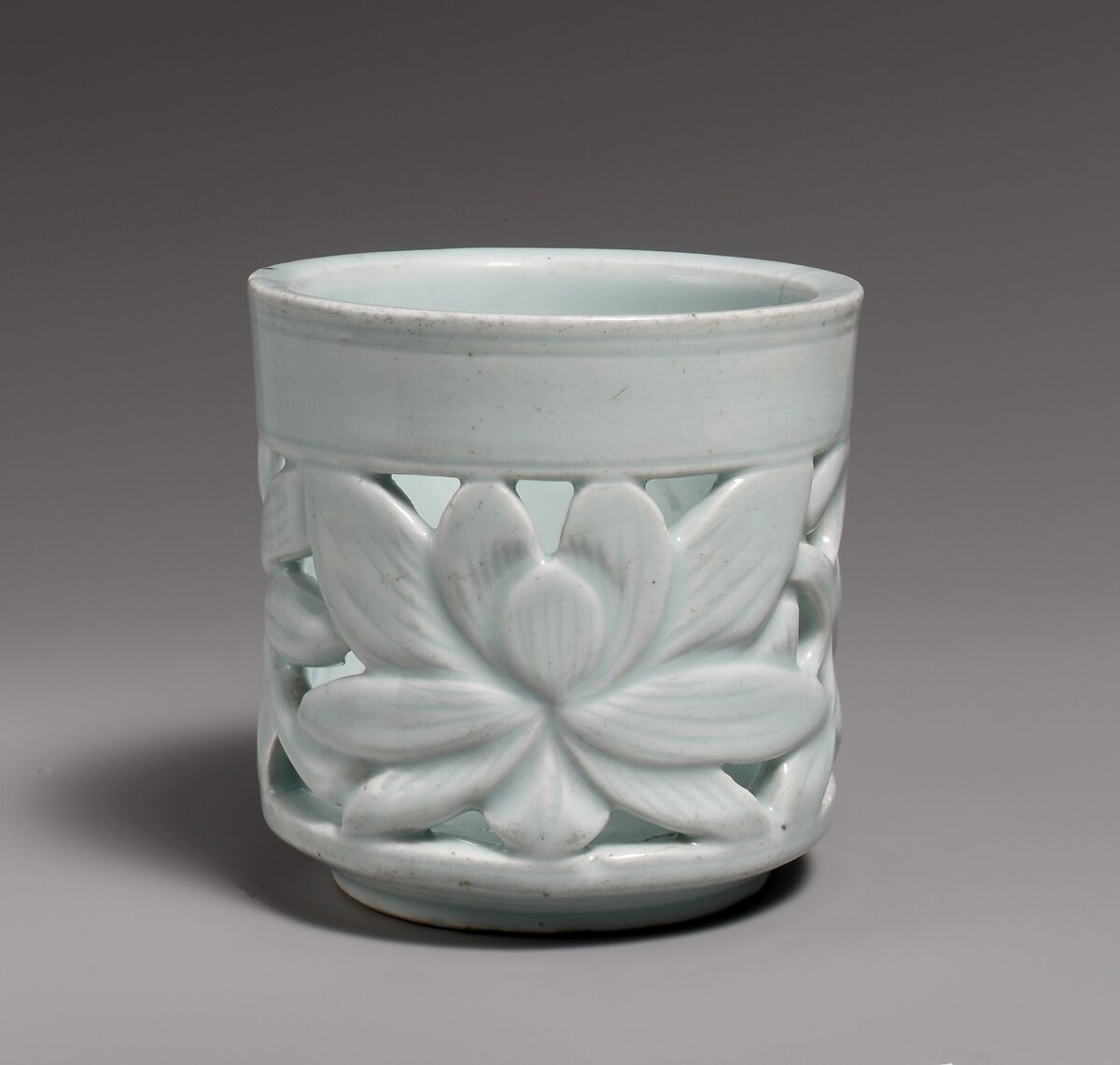 Brush holder with lotus decoration

