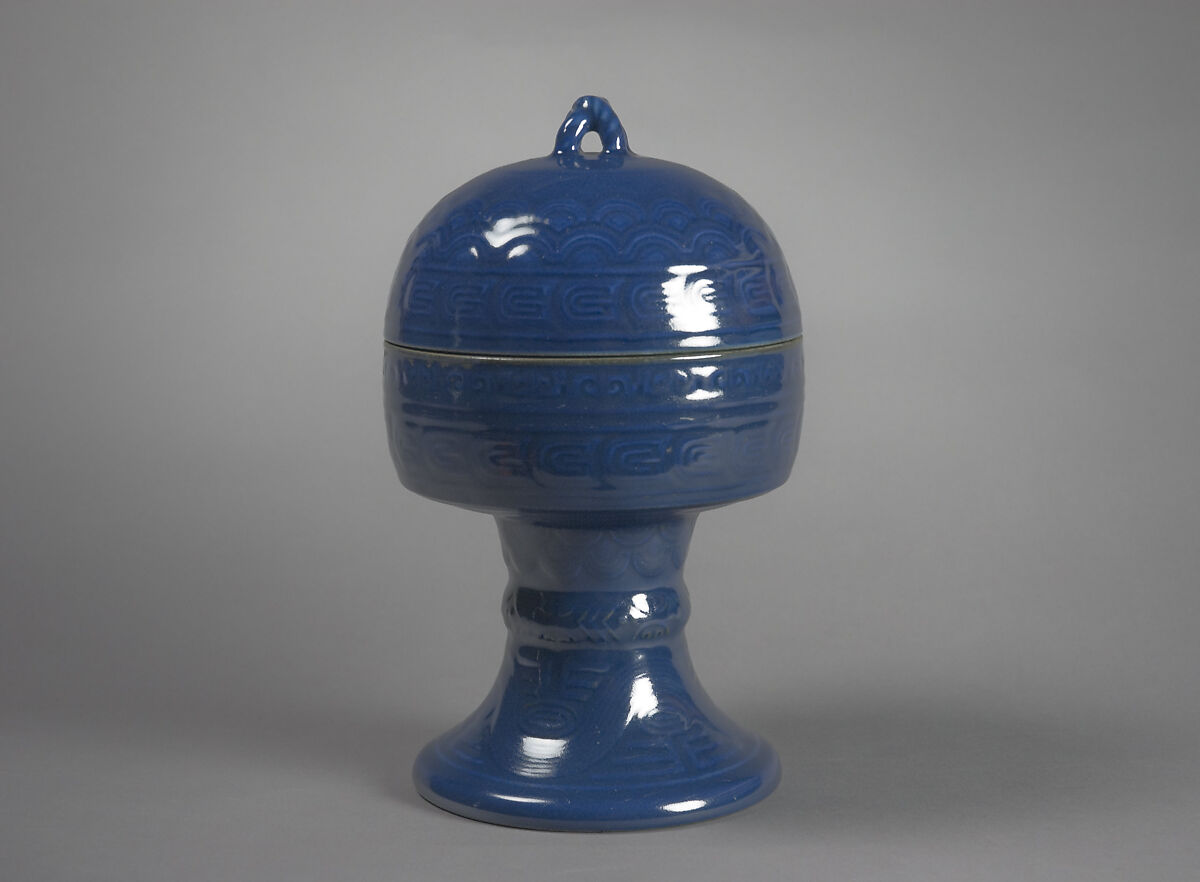 Vessel for Ritual Offering (Dou), Porcelain with low-relief decoration under dark blue glaze, China