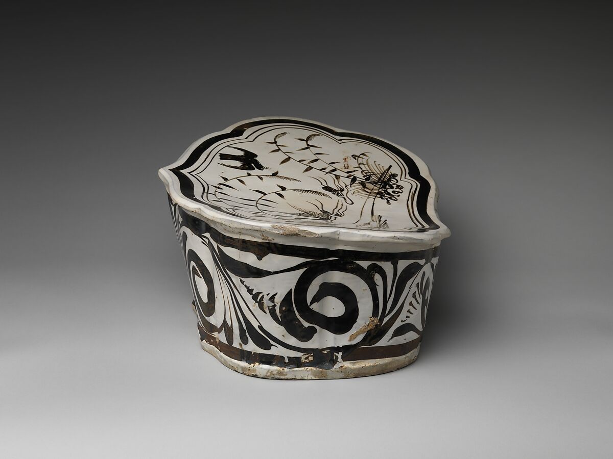 Pillow with a falcon attacking a swan, Stoneware painted with brown and black pigment on white slip under transparent glaze (Cizhou ware), China