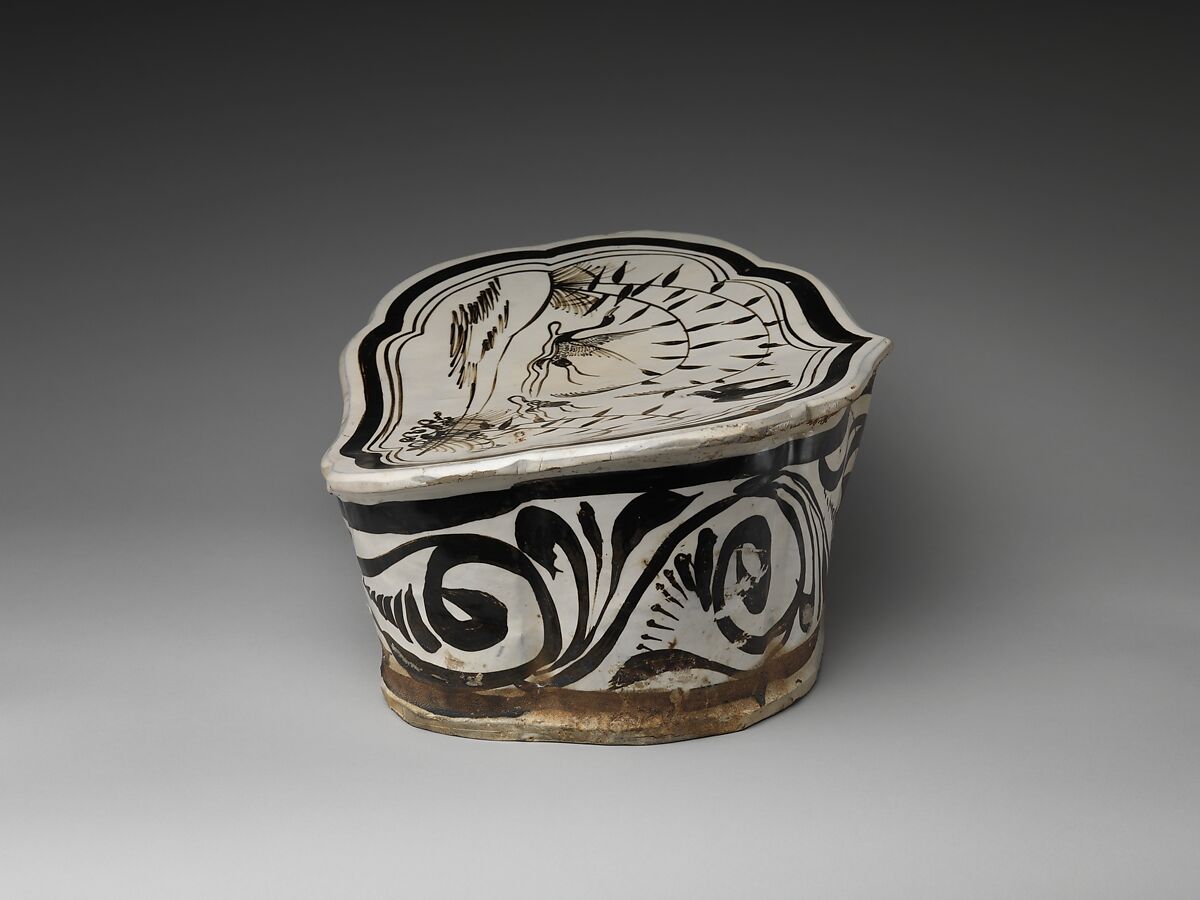 Pillow with a falcon attacking a swan, Stoneware painted with brown and black pigment on white slip under transparent glaze (Cizhou ware), China