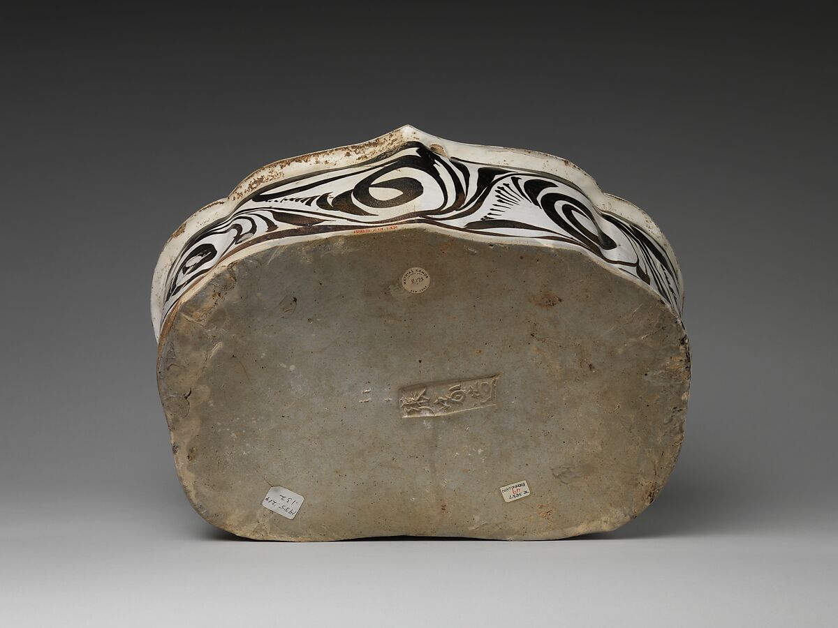 Pillow with a falcon attacking a swan, Stoneware painted with brown and black pigment on white slip under transparent glaze (Cizhou ware), China