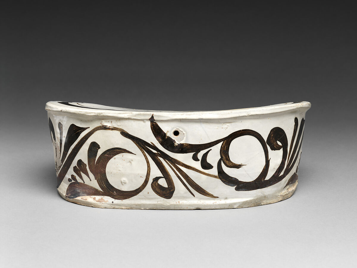 Pillow with boy on hobbyhorse, Zhang family workshop, Stoneware painted with brown and black pigment over white slip under clear glaze (Cizhou ware), China