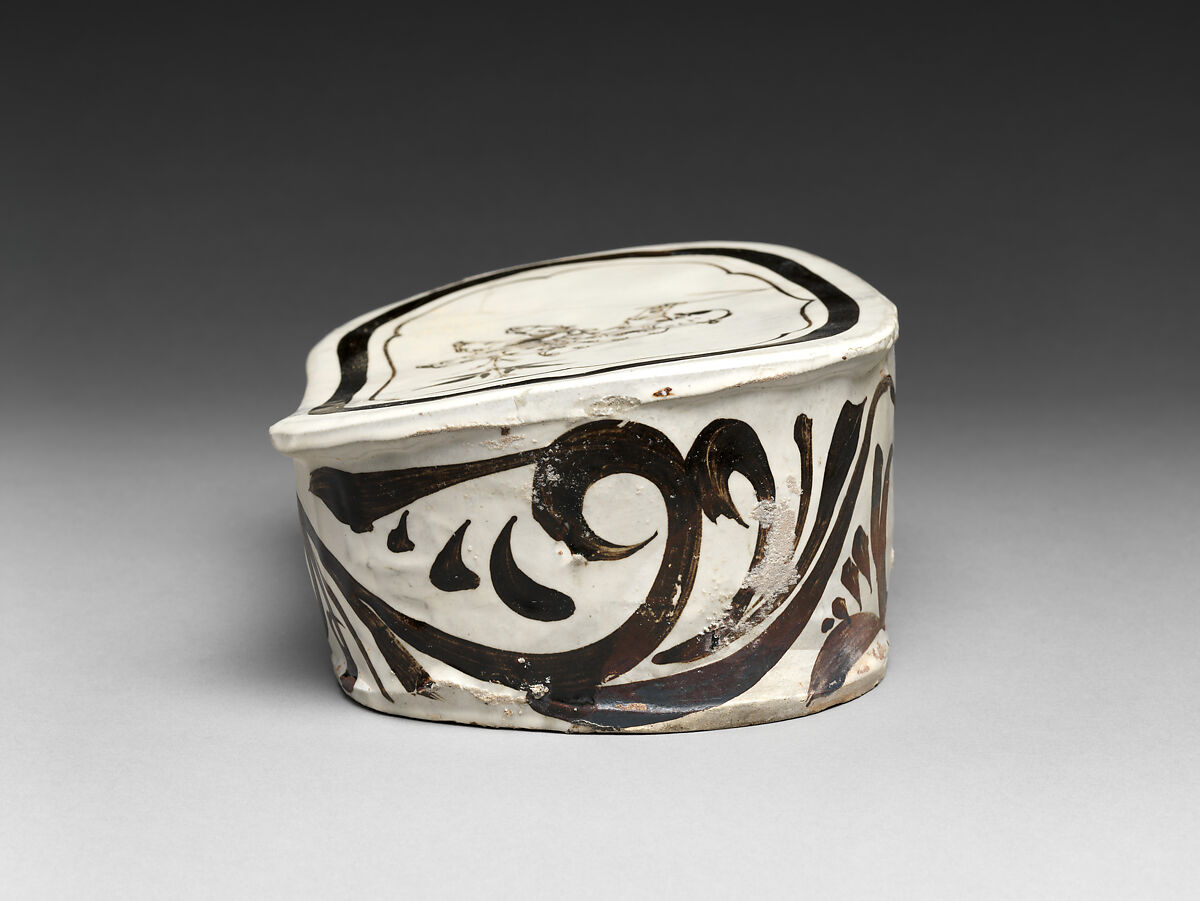 Pillow with boy on hobbyhorse, Zhang family workshop, Stoneware painted with brown and black pigment over white slip under clear glaze (Cizhou ware), China