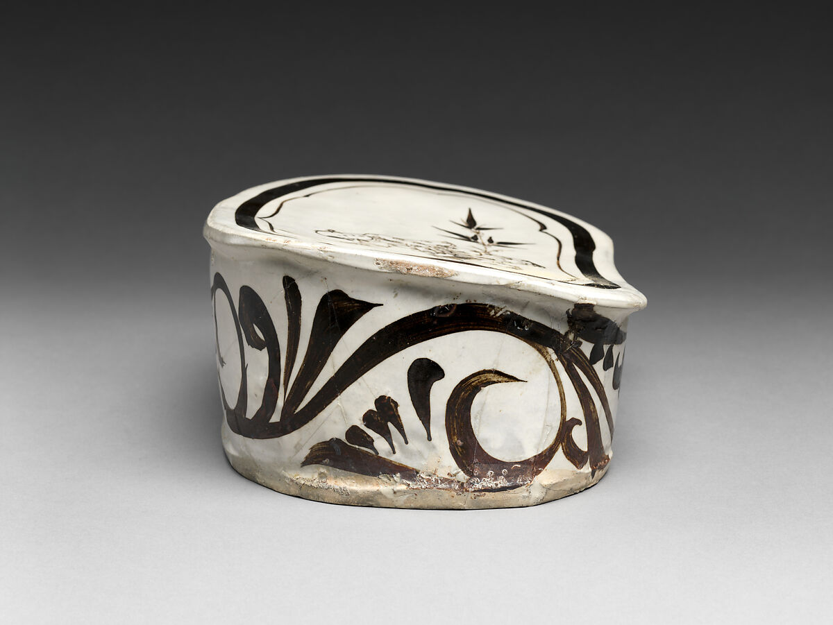 Pillow with boy on hobbyhorse, Zhang family workshop, Stoneware painted with brown and black pigment over white slip under clear glaze (Cizhou ware), China