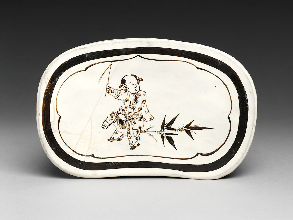 Pillow with boy on hobbyhorse, Zhang family workshop, Stoneware painted with brown and black pigment over white slip under clear glaze (Cizhou ware), China