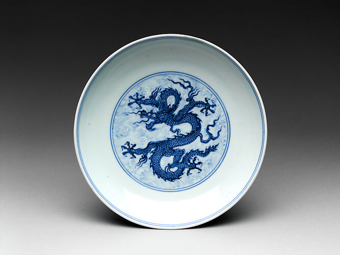 Dish with dragon amid waves

