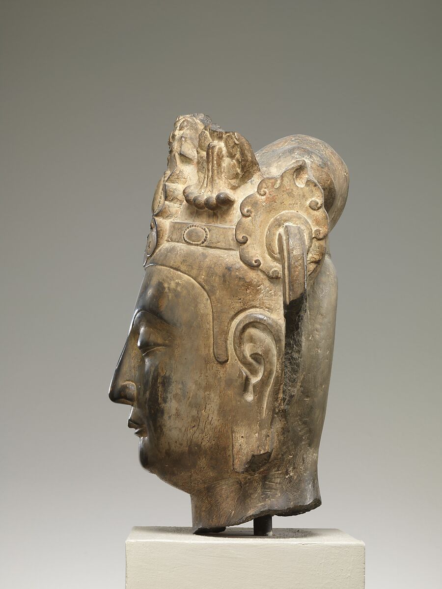 Head of an attendant bodhisattva, Limestone with pigment, China