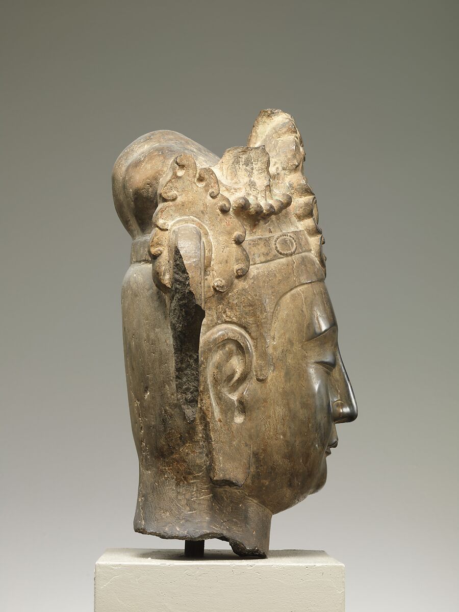 Head of an attendant bodhisattva, Limestone with pigment, China