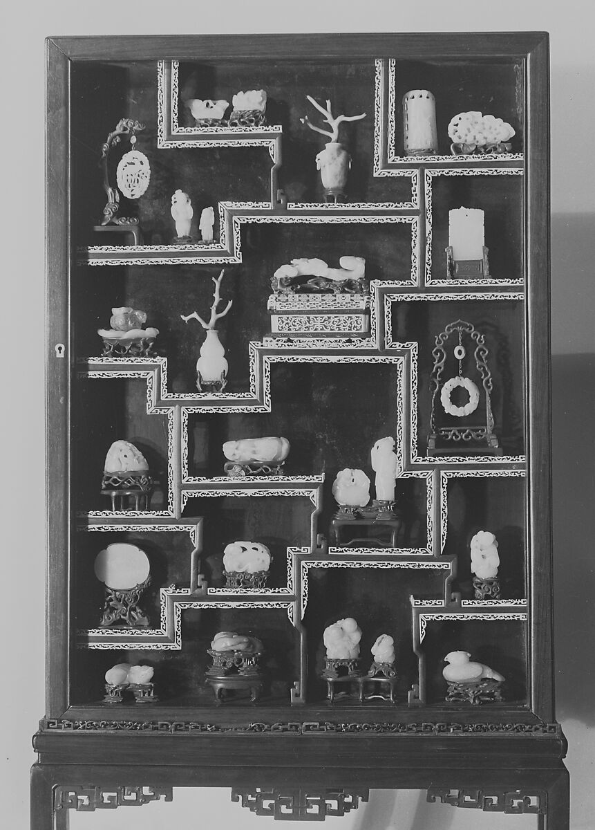Vitrine Containing Twenty-Five Ornaments, a-y: Jade and other materials: z: wood vitrine with strips of ivory fret, China 