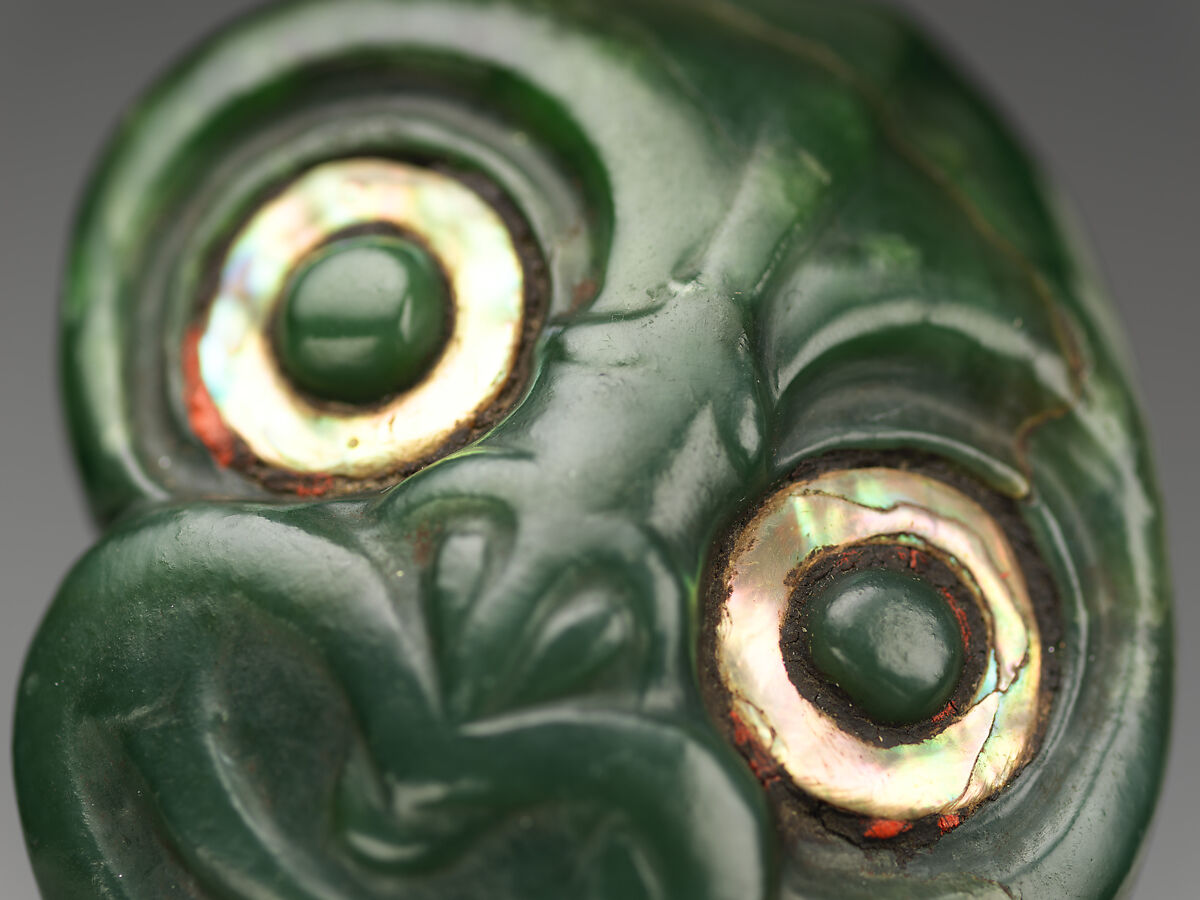 Greenstone pendant, Nephrite jade (pounamu), shell, pigment, and wax, Maori; Aotearoa New Zealand