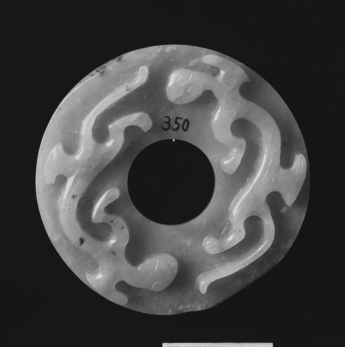 Perforated Medallion, Nephrite, white with light greenish tint., China 