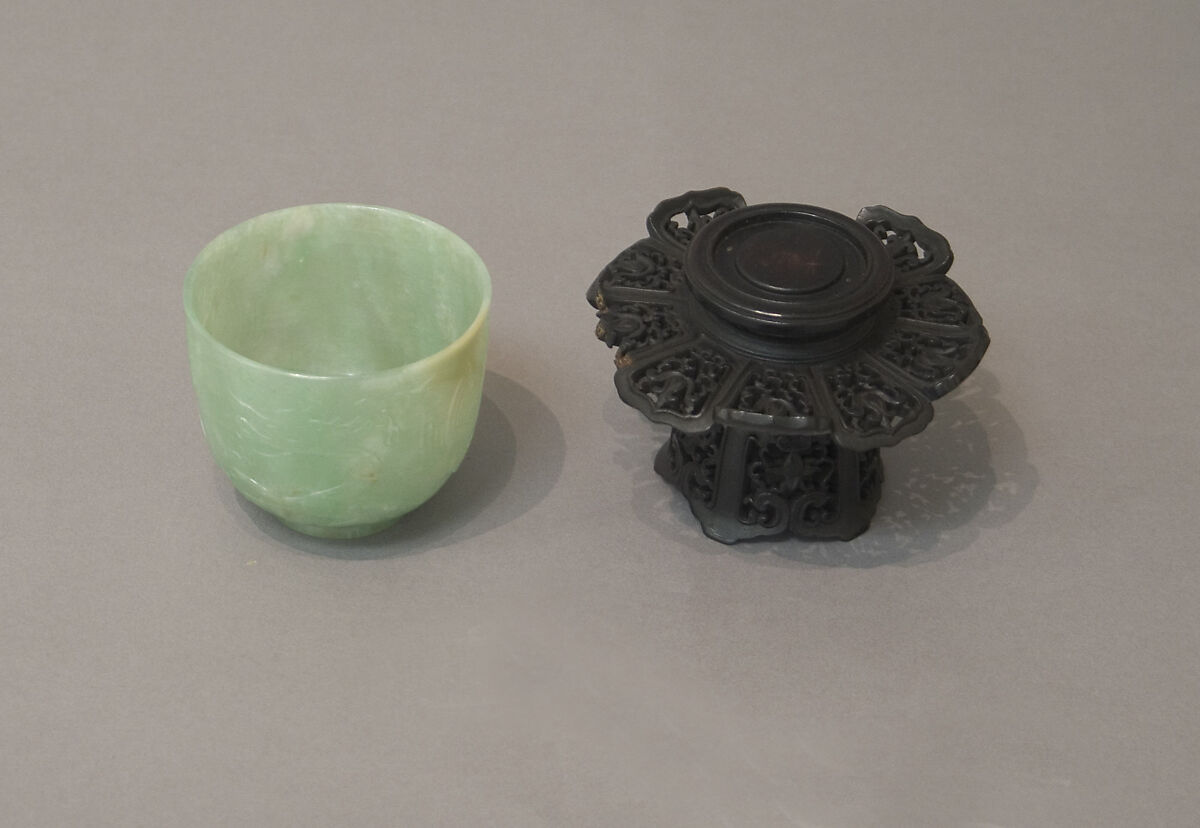 One of pair of cups, Jadeite, emerald-green running to lighter tints, and a few light clouds of creamy white tinged with russet, China