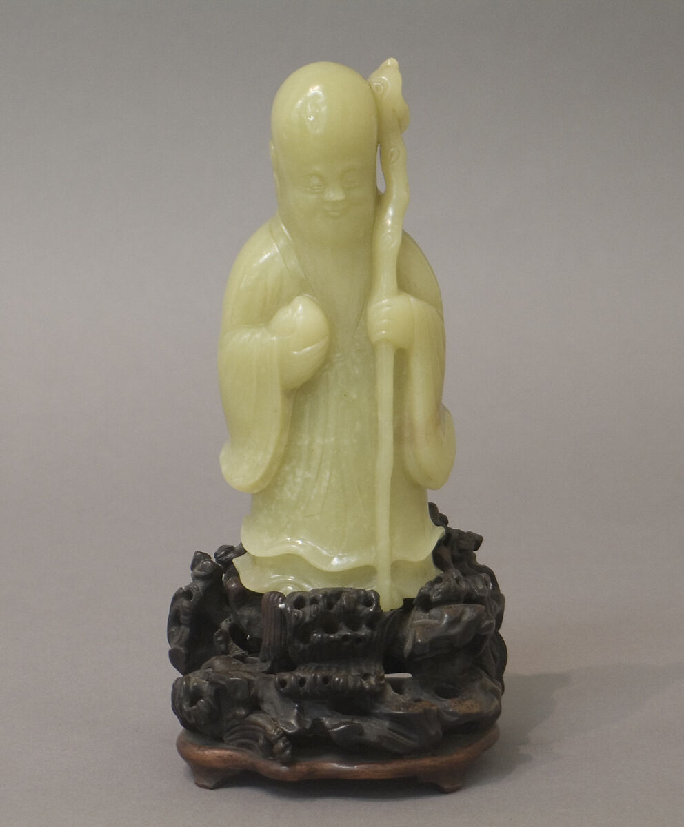 Figure of Shou Lao, Longevity Deity, Nephrite, yellow with a greenish tint and spots of very light brown, China 