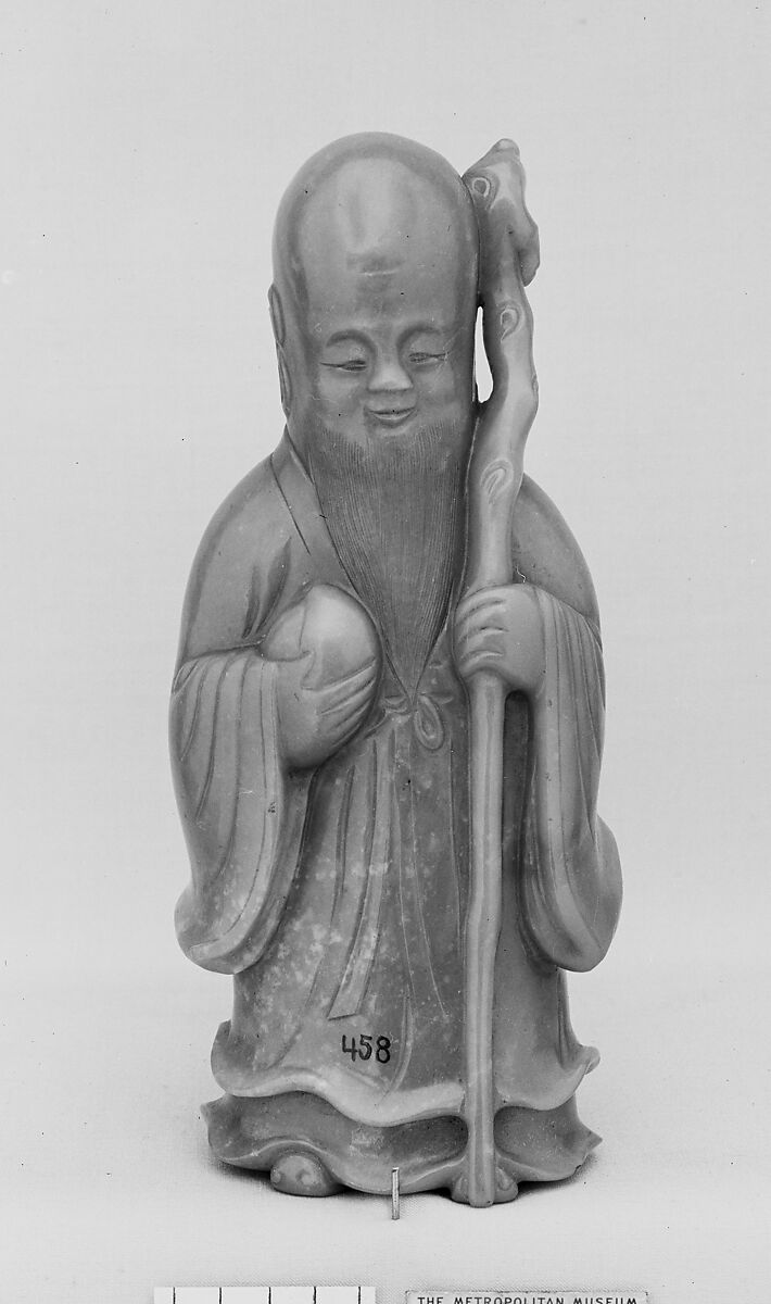 Figure of Shou Lao, Longevity Deity, Nephrite, yellow with a greenish tint and spots of very light brown, China