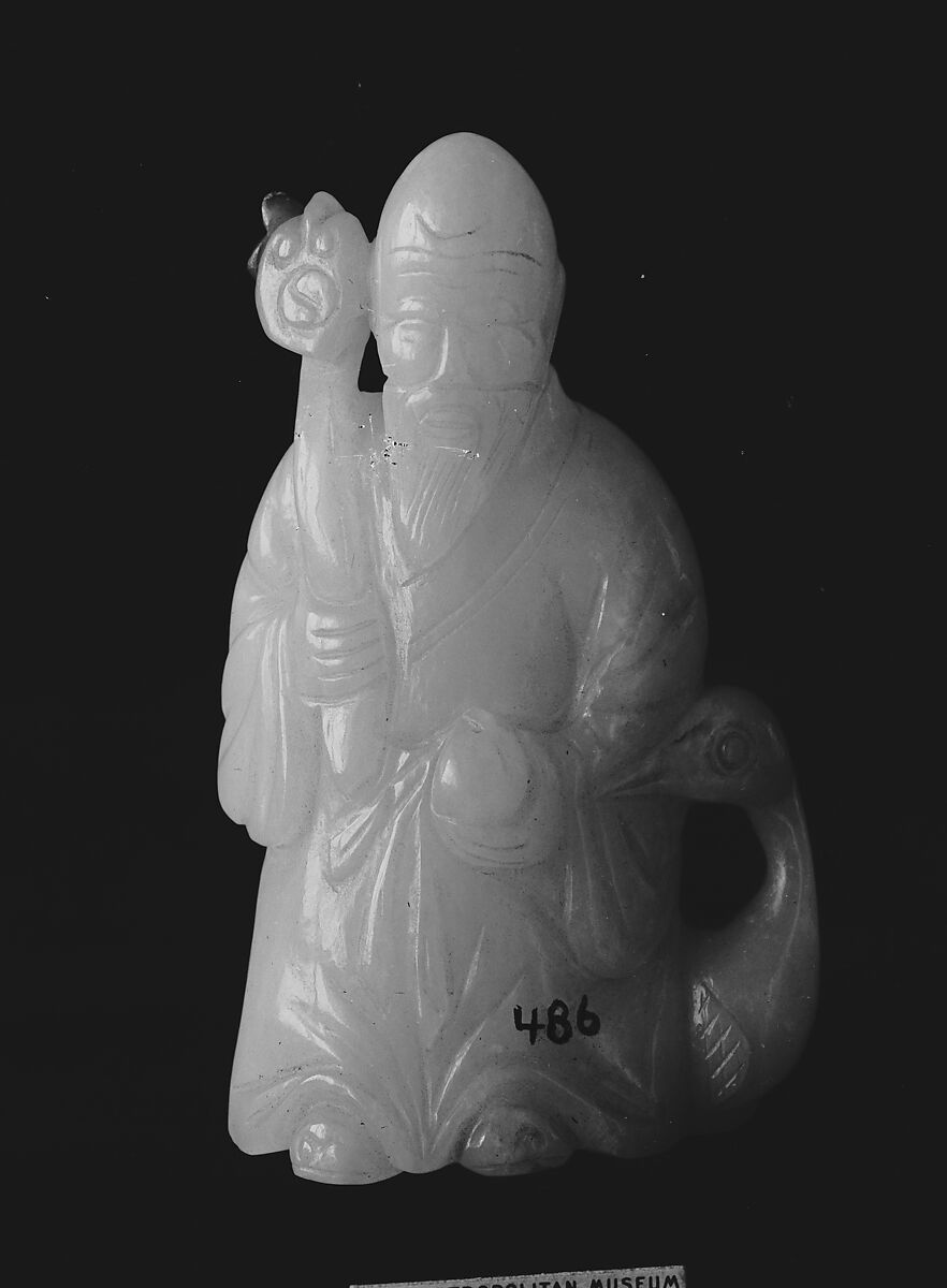 Figure of Shou Lao, Longevity Deity, Jadeite, light lavender with golden russet stainings in part, China 