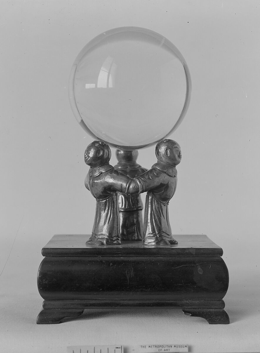 Crystal Ball on a Silver Stand composed of Three Figures, a) Rock crystal; b) Silver, China 