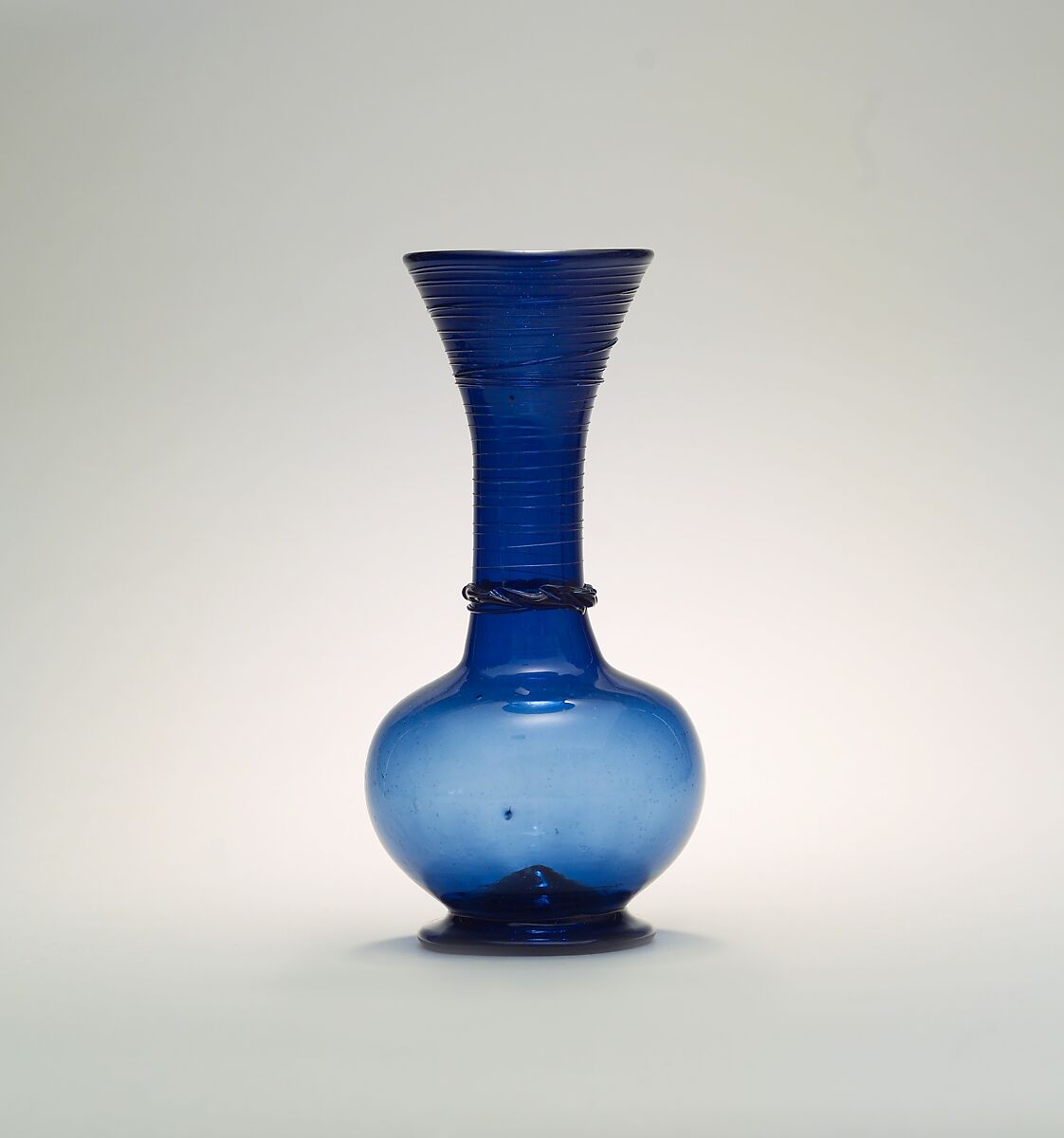 Bottle with a Globular Body, Glass, blue; free blown, folded foot, applied decoration 