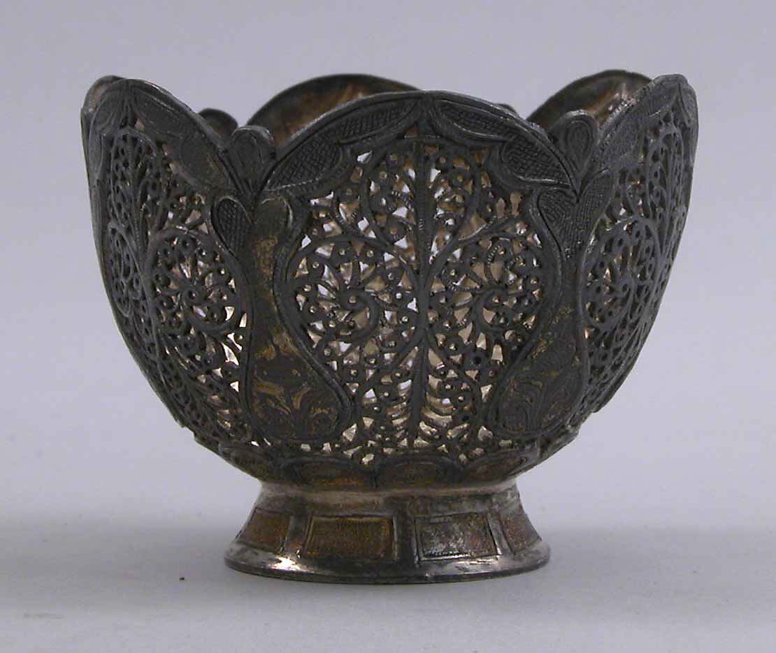 Cup and Holder, Cup: porcelain; glazed and painted
Holder: silver; pierced, engraved, and inlaid