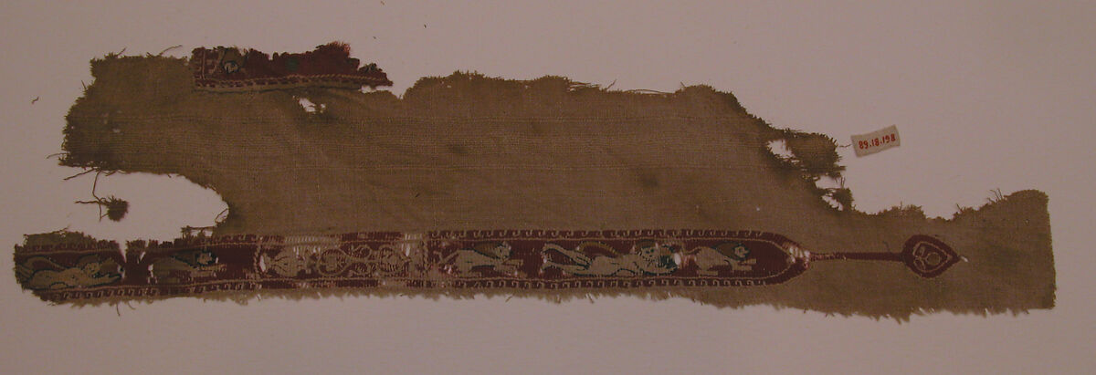 Tunic Fragment with Lions and Putti, Wool, linen; plain weave, tapestry weave