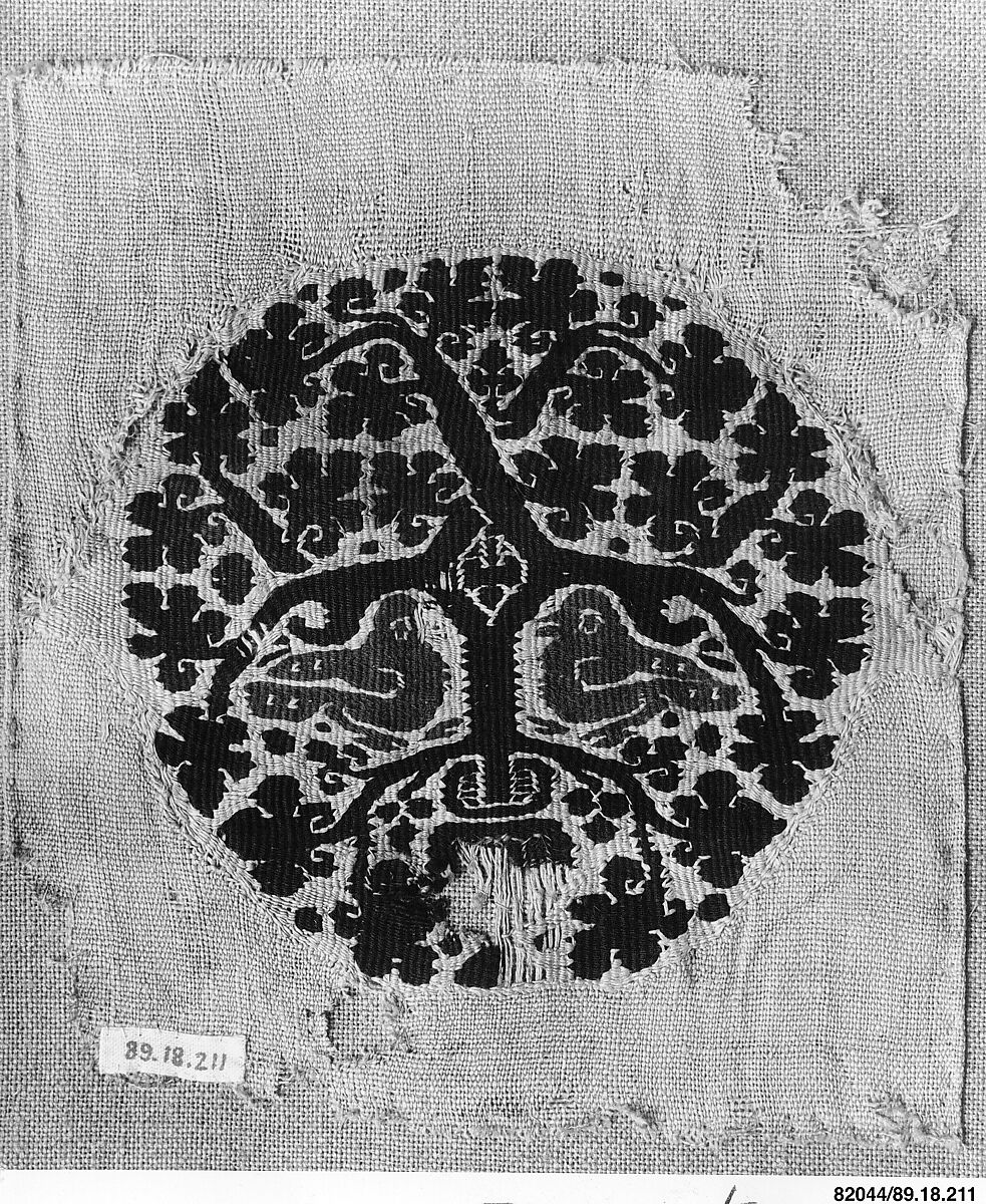 Orbiculus (Roundel) with Grapevine Inhabited by Two Purple Birds Emerging from a Pot, Wool, linen; plain weave, tapestry weave