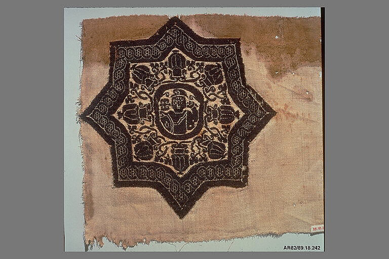 Fragment with an Eight-Pointed Star Containing a Warrior, Wool, linen; plain weave, tapestry weave
