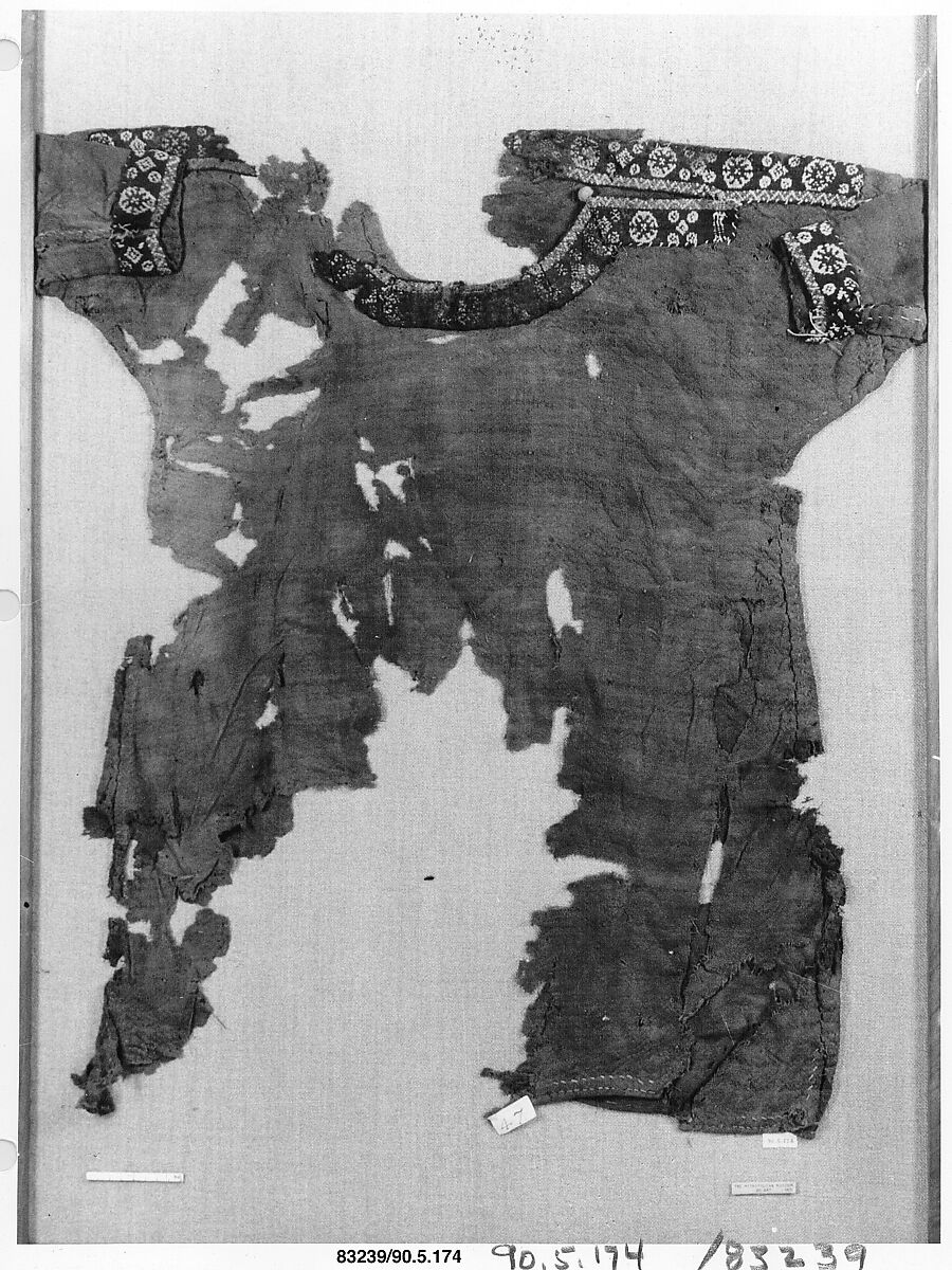 Child's Dress, Plain weave in red wool (dyed with madder); applied borders with pattern weft in blue and red wool and undyed linen