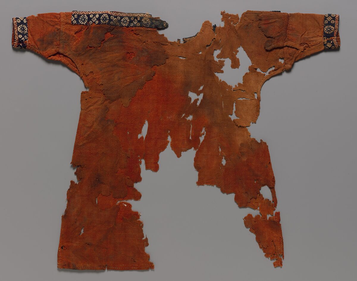 Child's Dress, Plain weave in red wool (dyed with madder); applied borders with pattern weft in blue and red wool and undyed linen