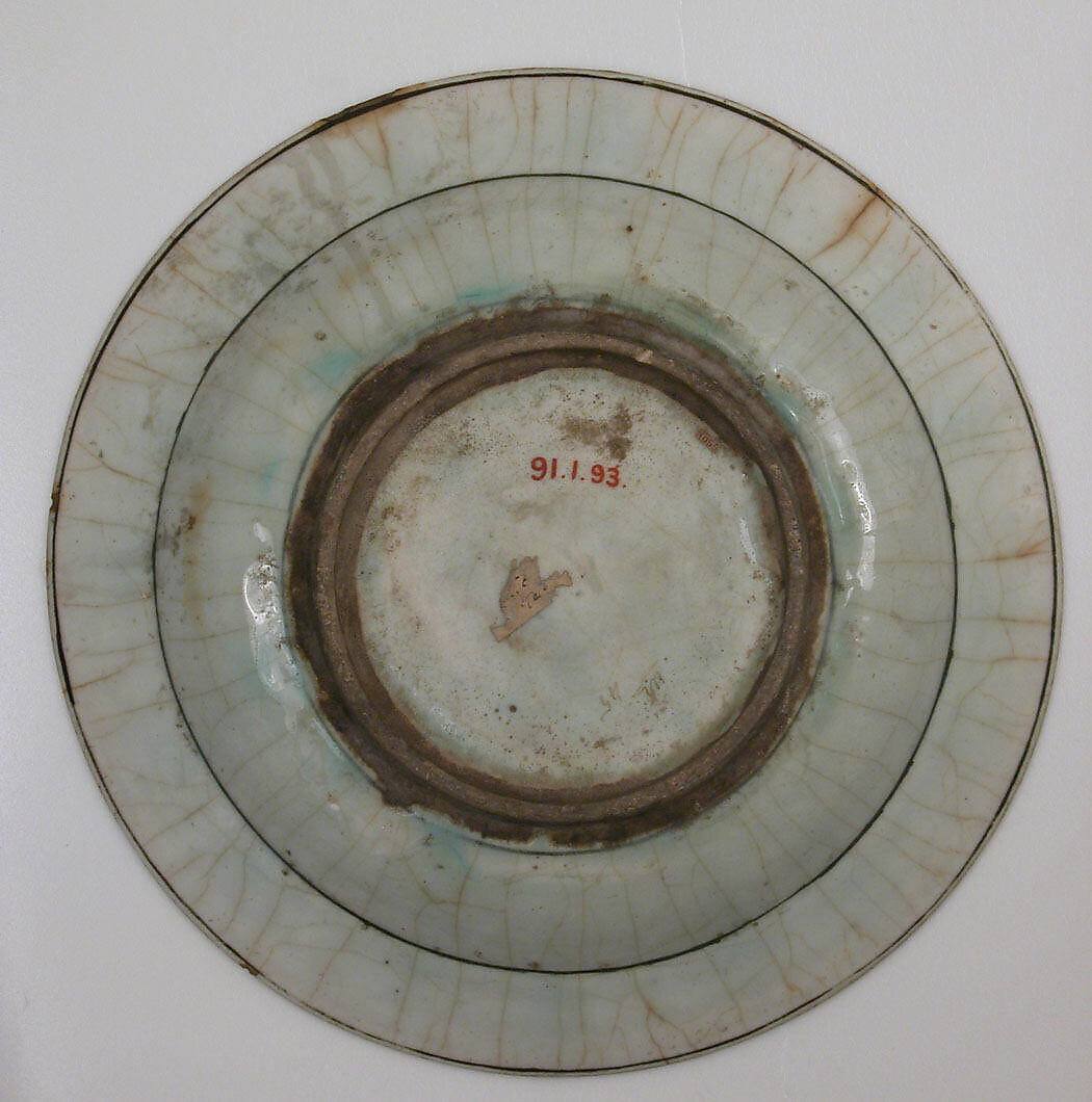 Dish, Stonepaste; underglaze painted in black, blue, and green with red slip