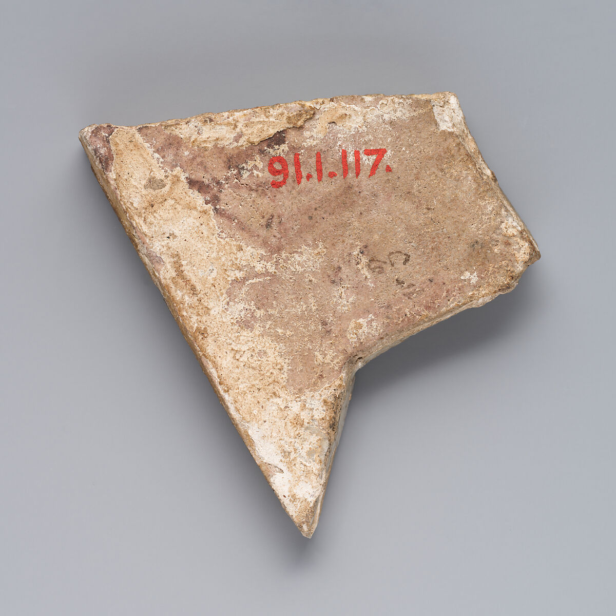 Fragment of a Star-Shaped Tile, Stonepaste; glazed and luster-painted