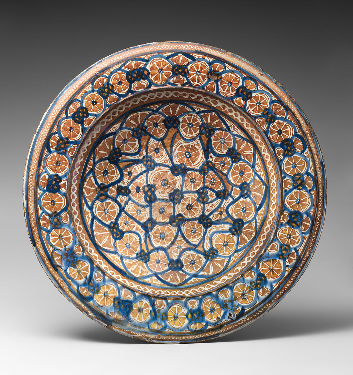 Plate, Earthenware; tin-glazed and luster-painted 