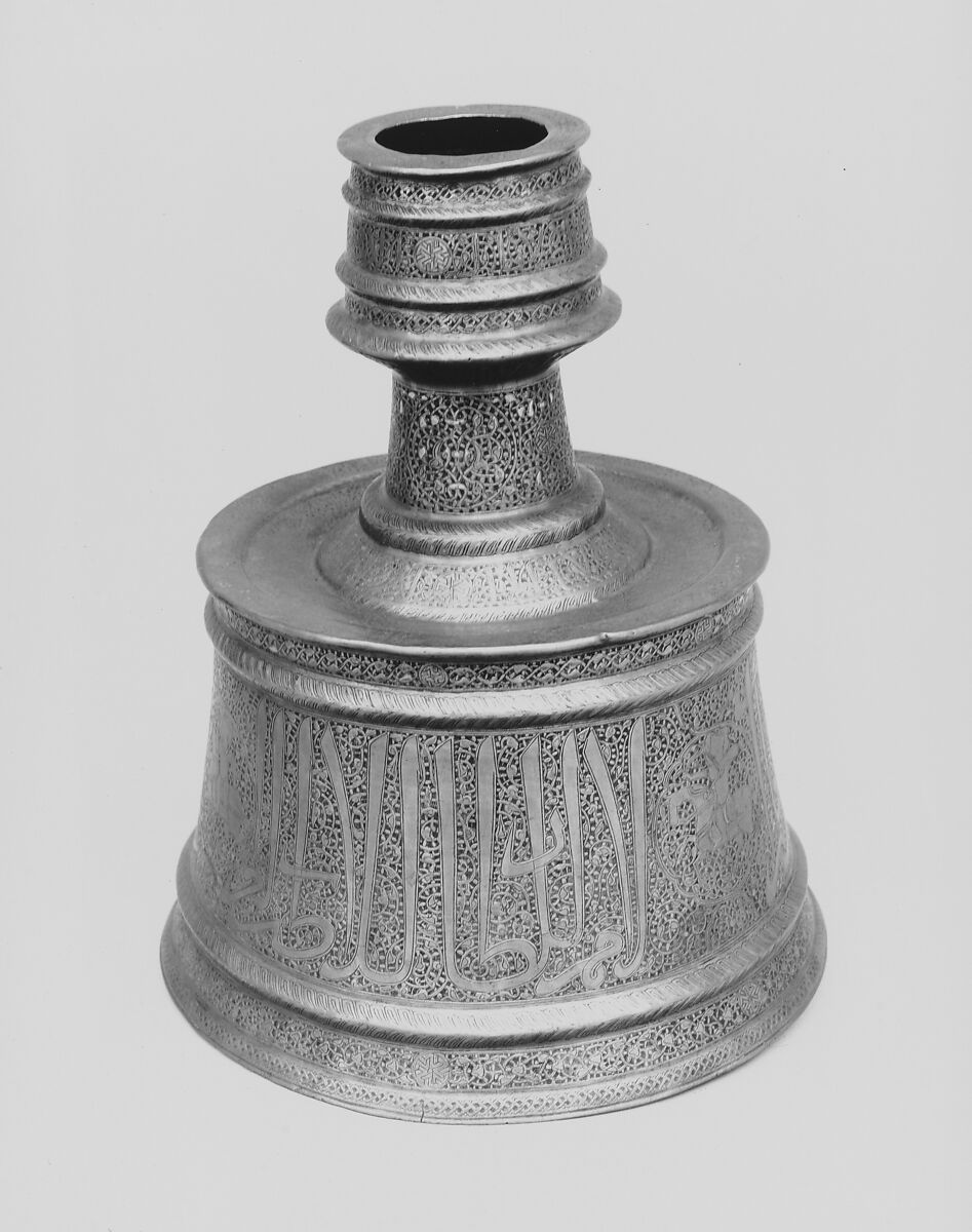 Candlestick with Horsemen and Arabic Inscriptions Conveying Good Wishes and Blessings Upon the Sultan, Brass; cast, engraved, and originally inlaid with silver
