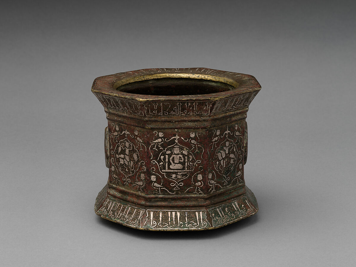 Mortar and Pestle made for Abu Bakr 'Ali Malikzad al-Tabrizi, Bronze; inlaid with silver and black compound 