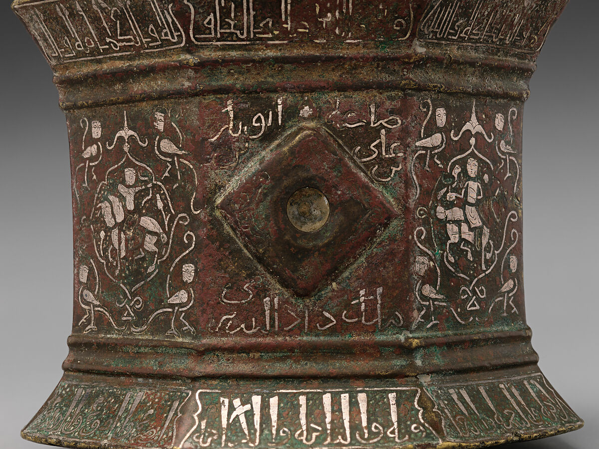Mortar and Pestle made for Abu Bakr 'Ali Malikzad al-Tabrizi, Bronze; inlaid with silver and black compound