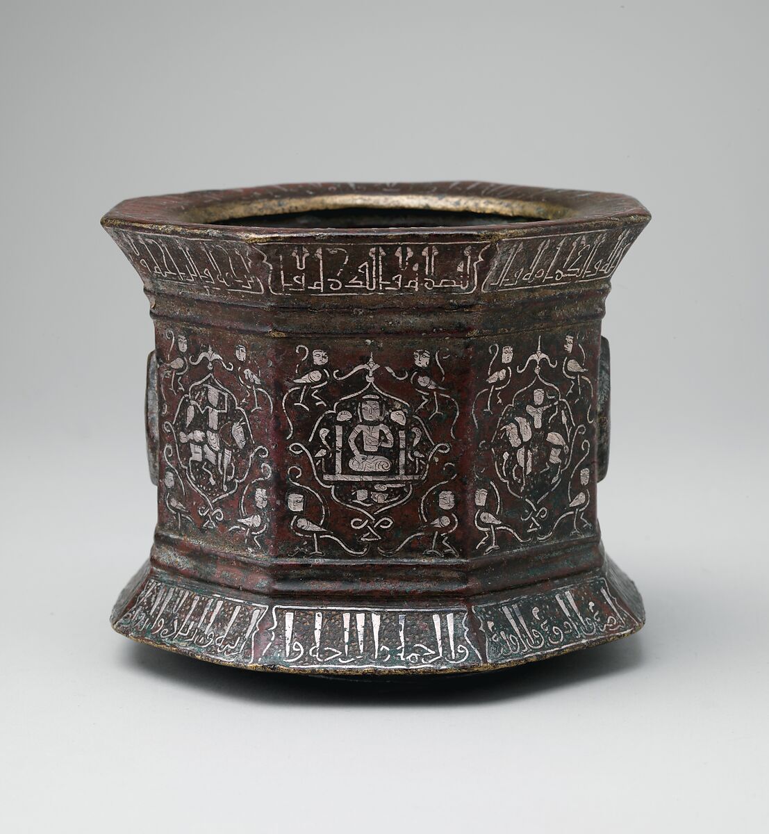 Mortar and Pestle made for Abu Bakr 'Ali Malikzad al-Tabrizi, Bronze; inlaid with silver and black compound