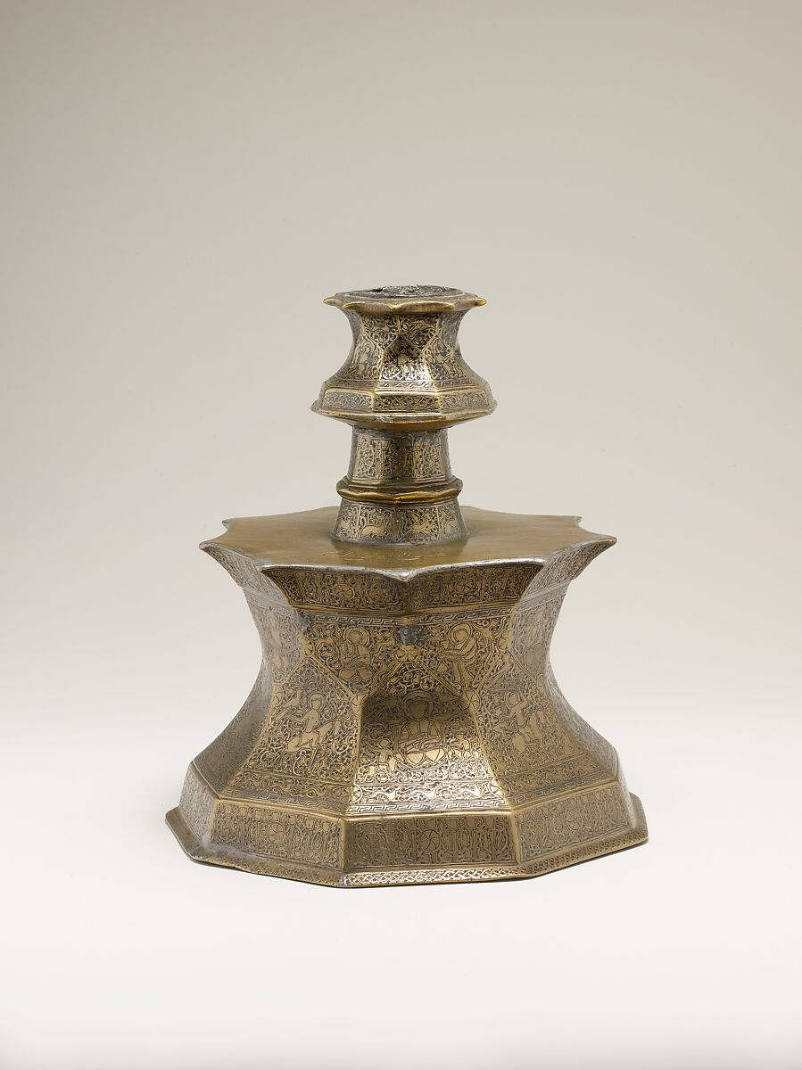 Candlestick with Figural Imagery, Brass; cast, engraved, and inlaid with silver and black compound 