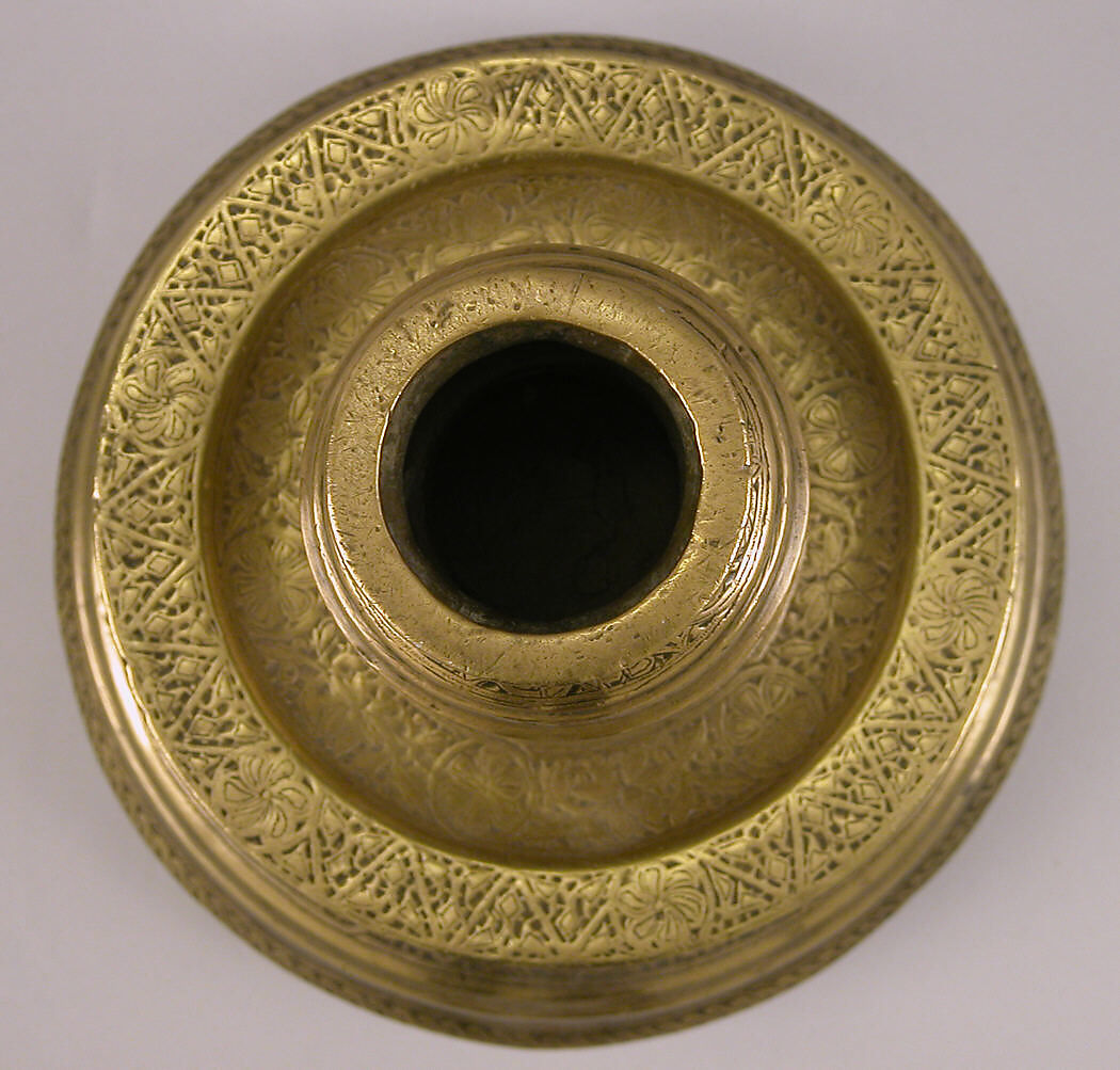 Candlestick with Repeating Seated Figure, Inscription, and Flowers, Brass; cast, engraved, and originally inlaid with silver