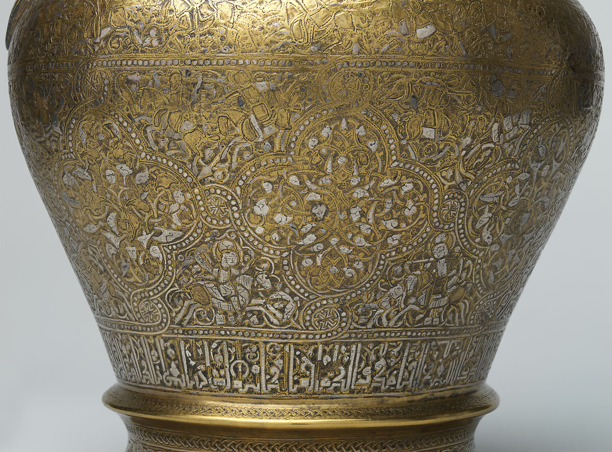 Ewer with Inscription, Horsemen, and Vegetal Decoration, `Umar ibn al-Hajji Jaldak, Brass; inlaid with silver and black compound