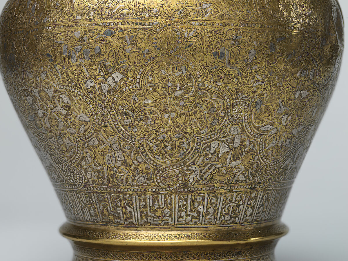 Ewer with Inscription, Horsemen, and Vegetal Decoration, `Umar ibn al-Hajji Jaldak, Brass; inlaid with silver and black compound