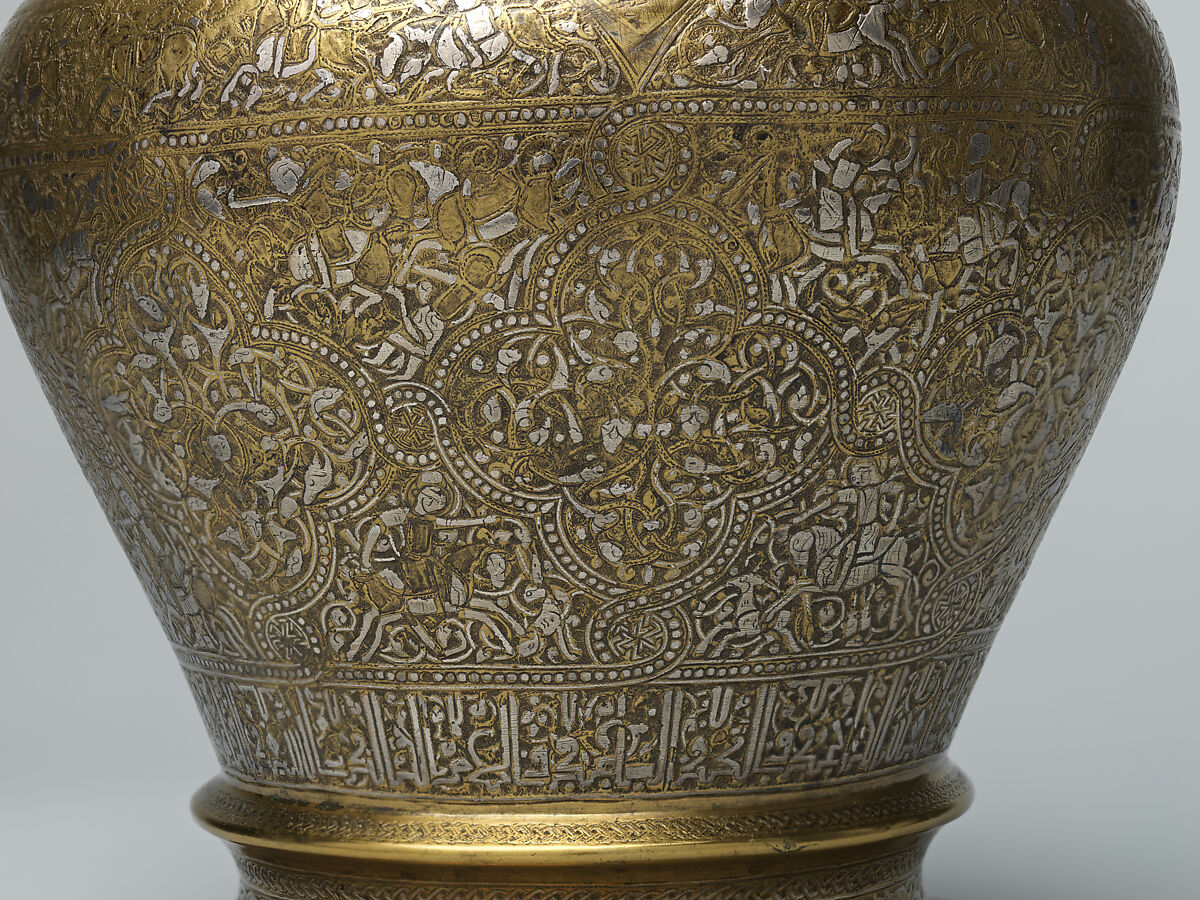 Ewer with Inscription, Horsemen, and Vegetal Decoration, `Umar ibn al-Hajji Jaldak, Brass; inlaid with silver and black compound