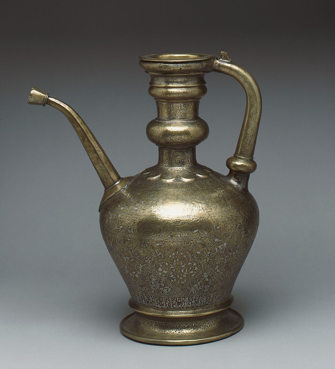 Ewer with Inscription, Horsemen, and Vegetal Decoration, `Umar ibn al-Hajji Jaldak, Brass; inlaid with silver and black compound