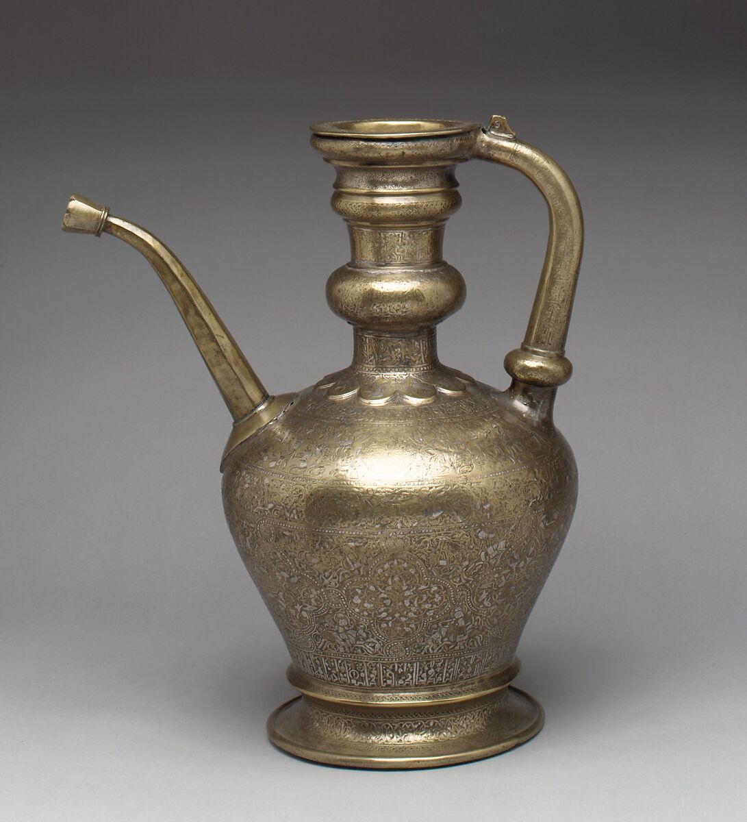 Ewer with Inscription, Horsemen, and Vegetal Decoration, `Umar ibn al-Hajji Jaldak, Brass; inlaid with silver and black compound