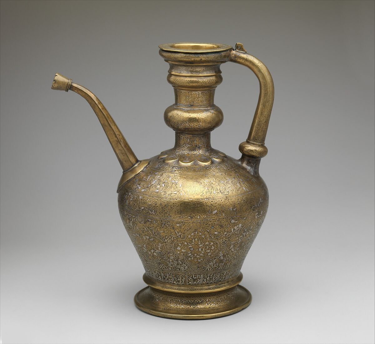 Ewer with Inscription, Horsemen, and Vegetal Decoration, `Umar ibn al-Hajji Jaldak, Brass; inlaid with silver and black compound