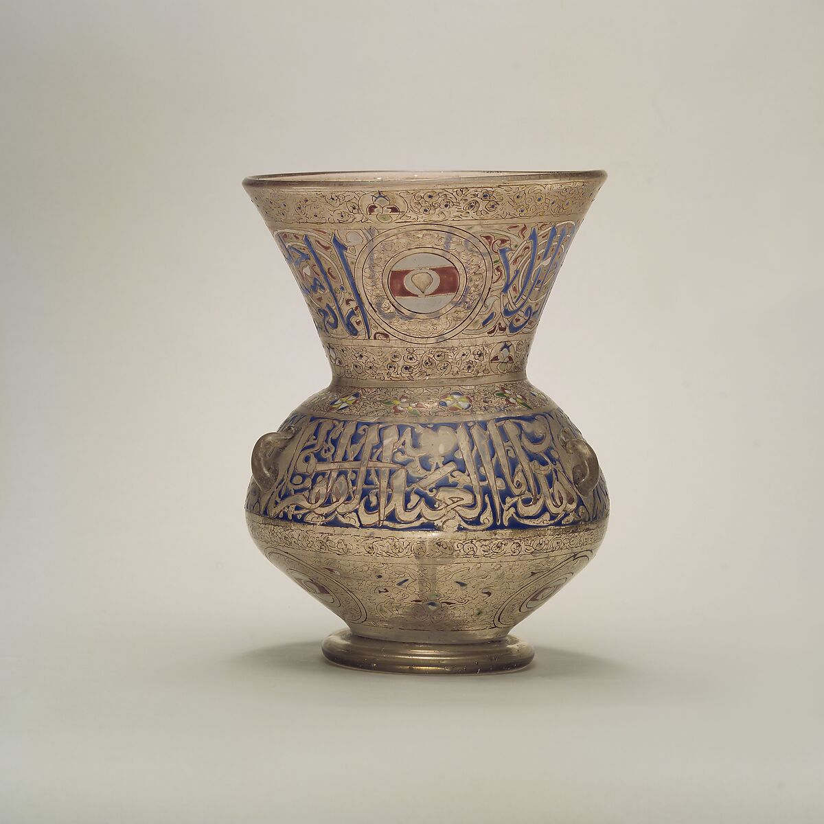 Mosque Lamp of Amir Ahmad al-Mihmandar, Glass, colorless with brown tinge; blown, folded foot, applied wick holder and handles, enameled and gilded 