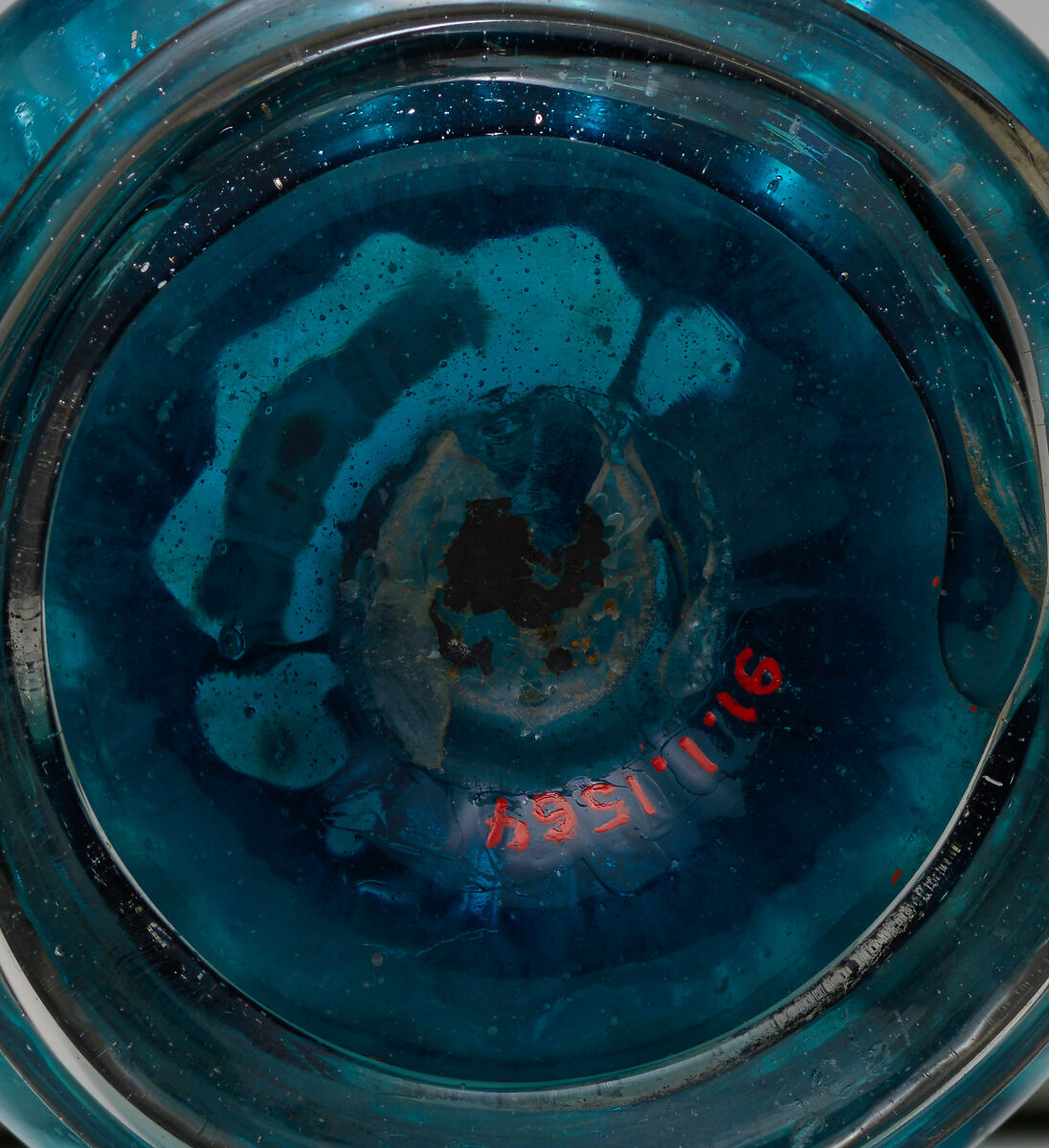 Turquoise Glass Bottle with an Onion Shaped Body, Glass, turquoise; dip-molded, blown, applied greyish foot ring and decoration