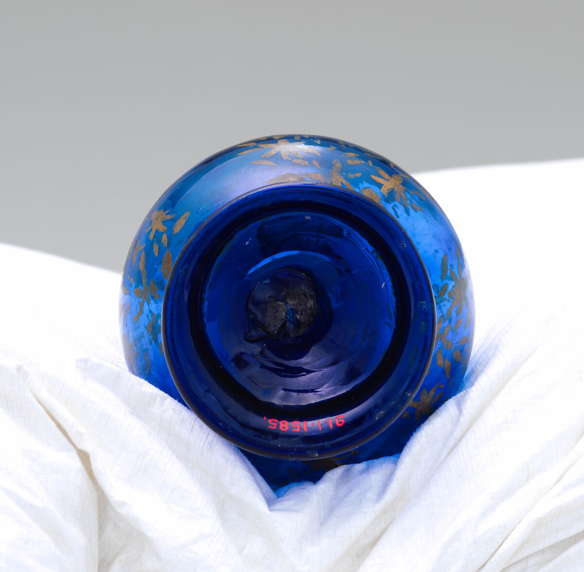 Bottle, Glass; mold blown and gilded, tooled on the pontil