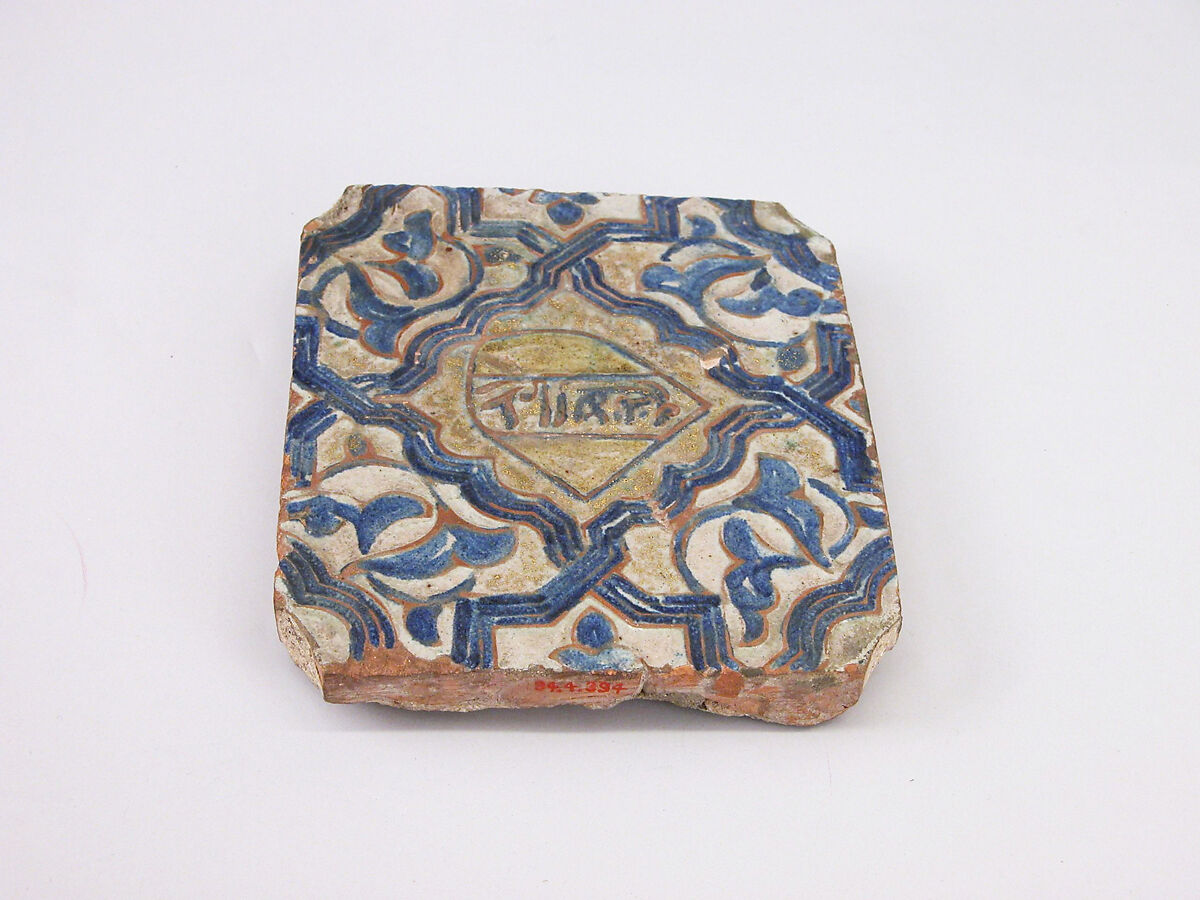 Tile, Earthenware; molded, cobalt-painted on an opaque white glaze powdered with gold under a transparent glaze